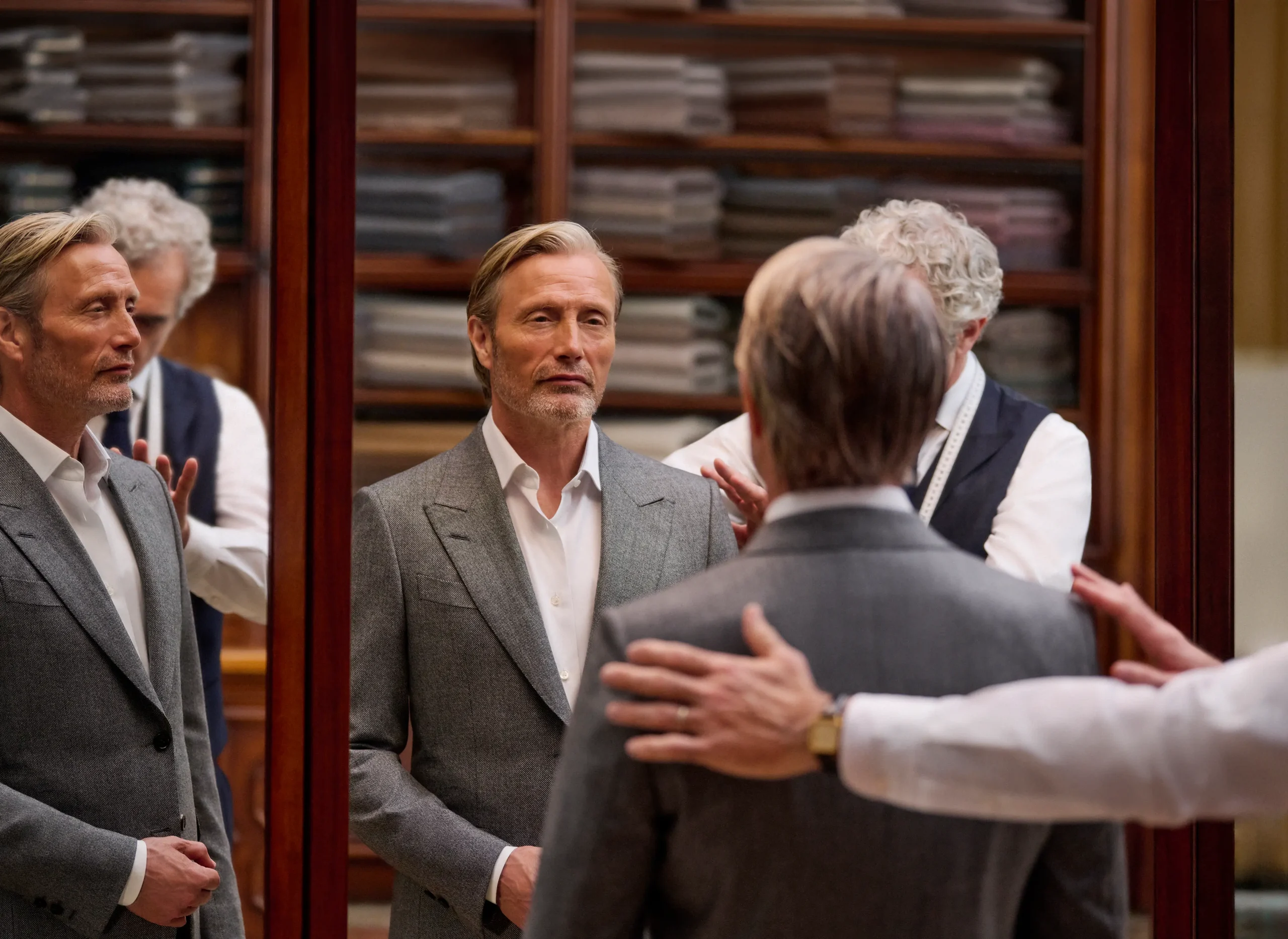 https://www.koesound.com/wp-content/uploads/2026/09/fw26-mads-mikkelsen-grey-suit-tailor-fitting_M13-desktop-ratio137-scaled.webp
